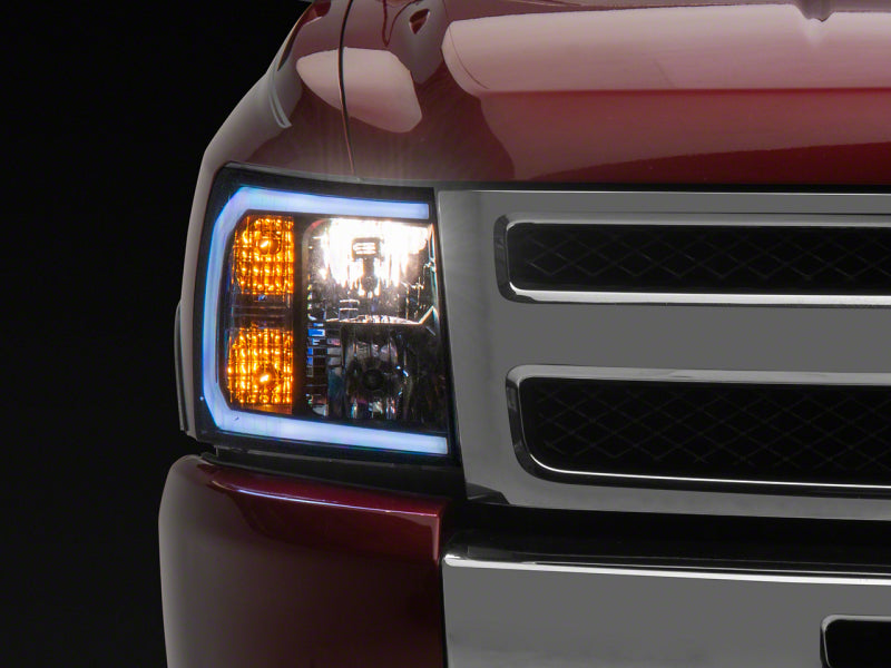 RAXIOM 07-13 Chevrolet Silverado 1500 Axial Headlights w/ SEQL LED Bar- Blk Housing (Clear Lens)