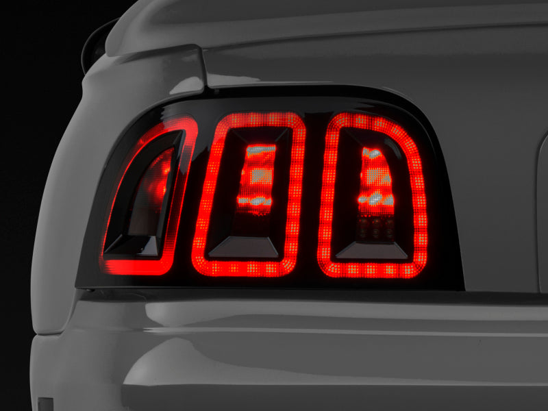 RAXIOM 96-98 Ford Mustang Icon LED Tail Lights- Black Housing (Smoked Lens)