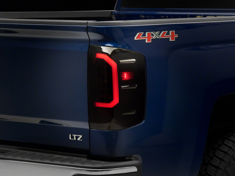 RAXIOM 14-18 Chevrolet Silverado 1500 Axial Series LED Tail Lights- Blk Housing (Smoked Lens)