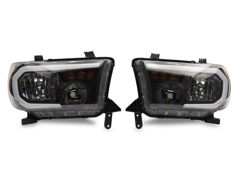 RAXIOM 07-13 Toyota Tundra Axial Series Headlights w/ SEQL LED Bar- Blk Housing (Clear Lens)