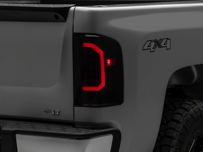 RAXIOM 07-14 Chevrolet Silverado 1500 Axial Series LED Tail Lights- Blk Housing (Smoked Lens)