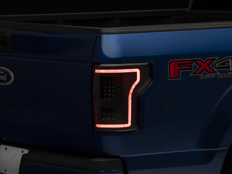 RAXIOM 15-17 Ford F-150 LED Tail Lights w/ SEQL Turn Signals- Blk Housing (Clear Lens)