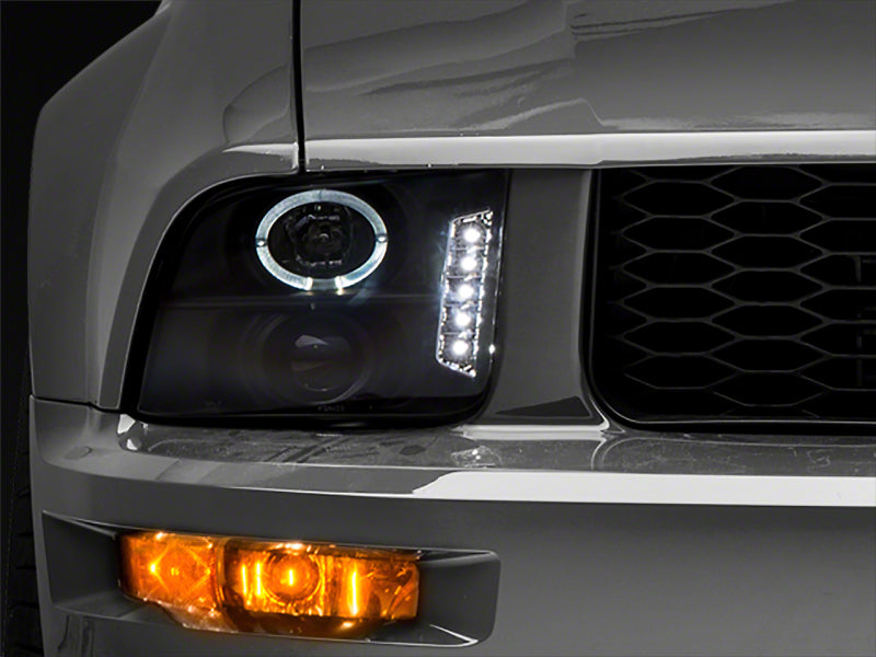 RAXIOM 05-09 Ford Mustang Excluding GT500 LED Halo Projector Headlights- Blk Housing (Clear Lens)