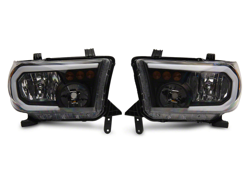 RAXIOM 07-13 Toyota Tundra Axial Series Headlights w/ LED Bar- Blk Housing (Clear Lens)