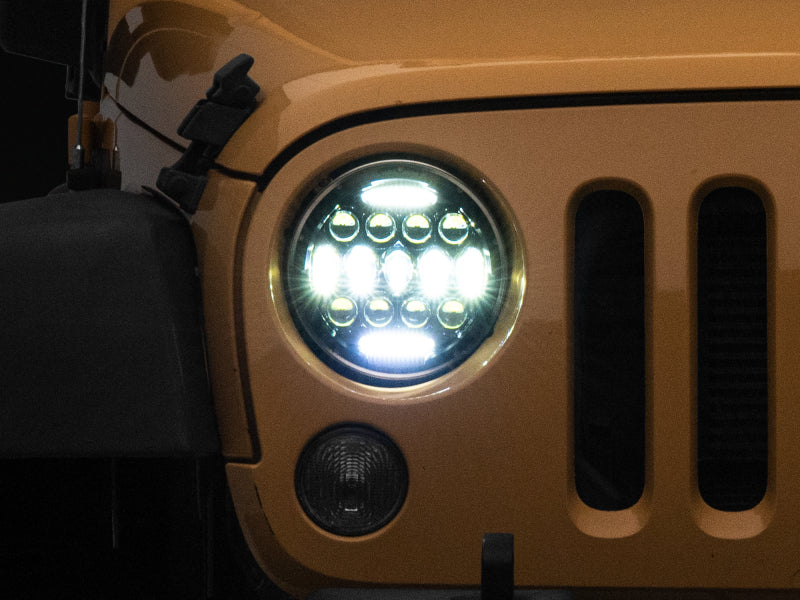 RAXIOM 97-18 Jeep Wrangler TJ/JK Axial Series 13-LED Headlights- Black Housing (Clear Lens)