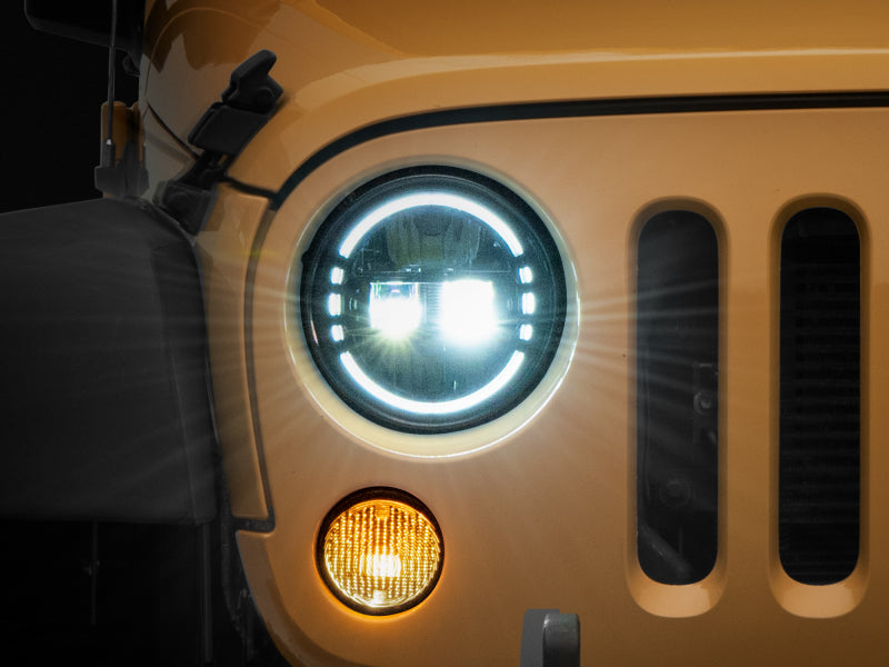 RAXIOM 97-18 Jeep Wrangler TJ/JK Axial 7-Inch LED Headlights w/ DRL- Black Housing (Clear Lens)